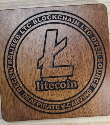 LTC Litecoin on a wooden coaster